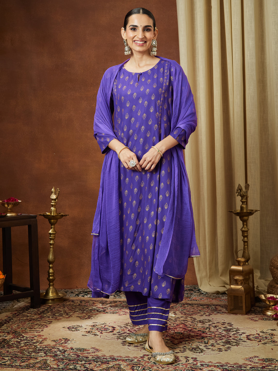 Ninnique Women's Purple Rayon Ethnic Motifs Gold Printed A-line Kurta Set